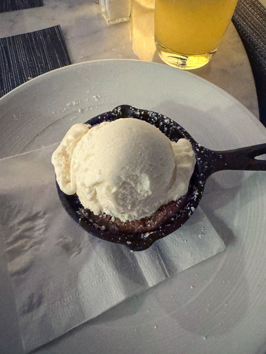 Chocolate chip skillet cookie with vanilla ice cream.