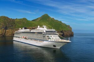 Cruise Ship Docked Near Island. 