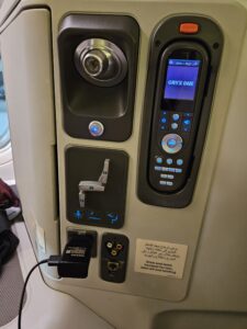 qatar airways 777 remote and power outlet.