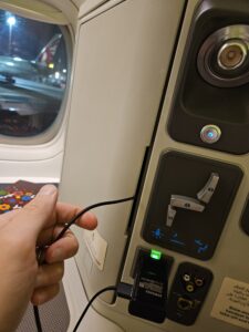 qatar airways 777 cabinet with headphone chord