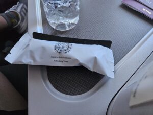 qatar airways 777 refreshing towel and mint.