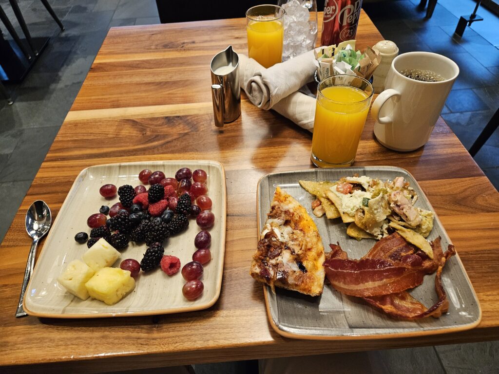 hyatt regency seattle breakfast buffet pizza chilaquiles bacon orange juice coffee