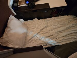 virgin atlantic business class bed bedding laid out