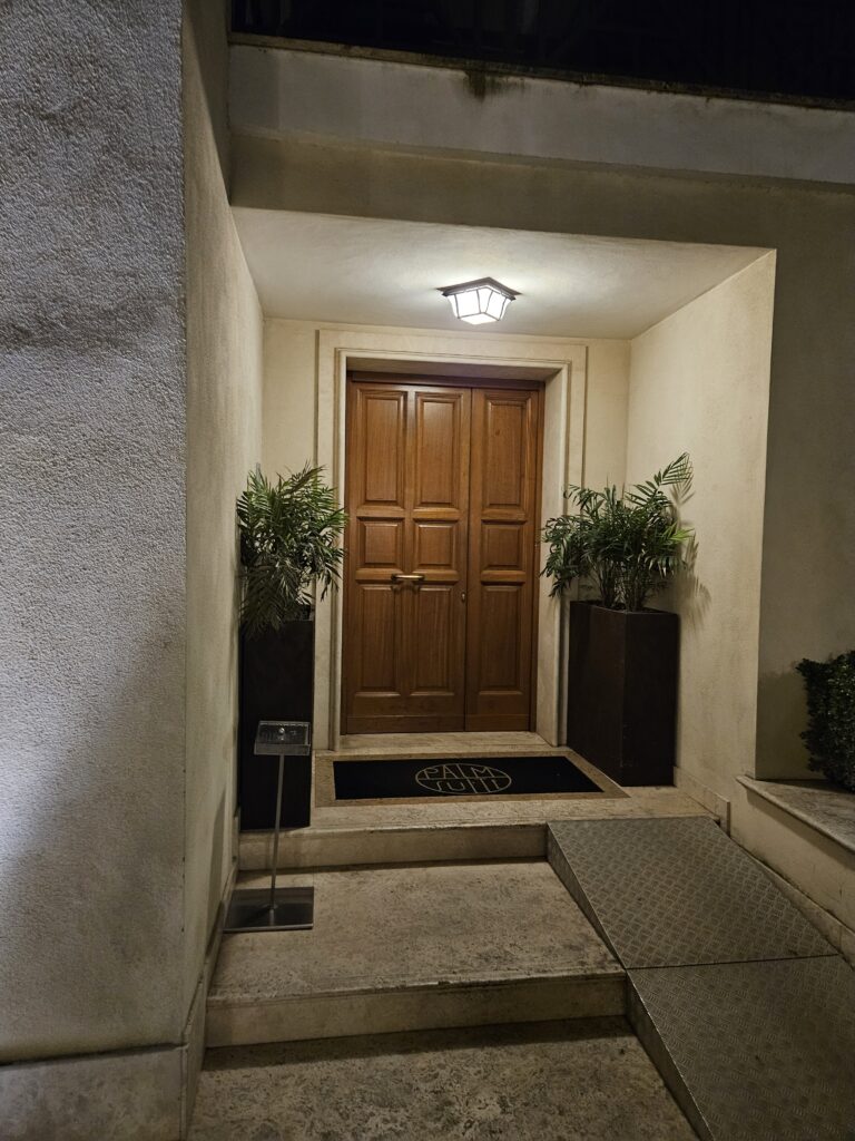 palm suites rome front entrance historical door