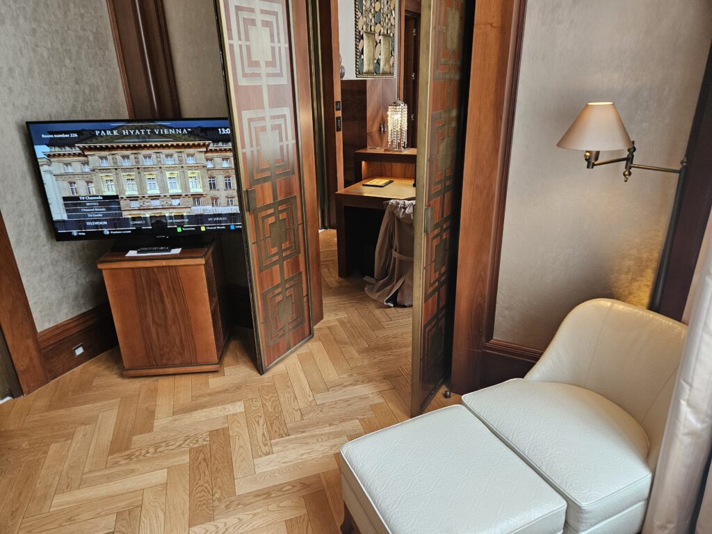 park hyatt vienna park suite deluxe bedroom tv television sitting area chair automan